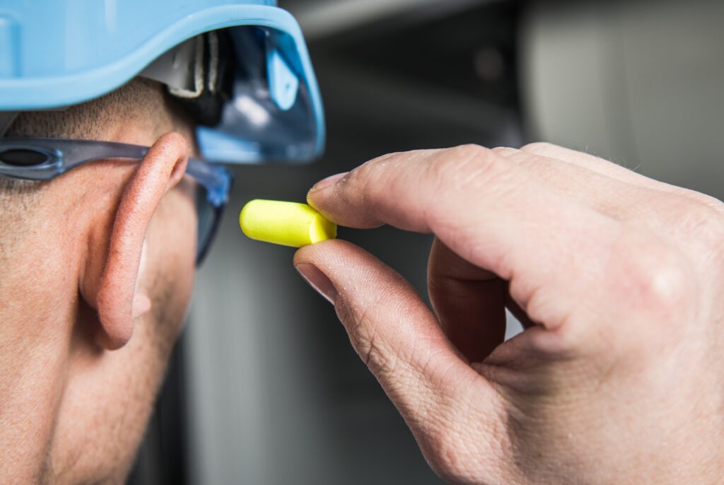 Man wearing earplugs